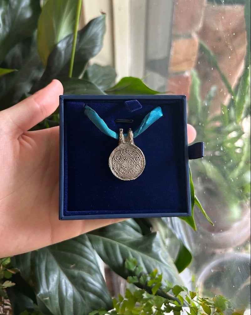 Silk Road Pendant: Elegant Silver Pendant on Silk Cord