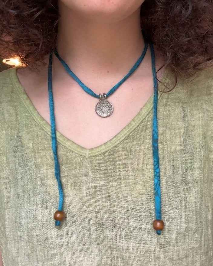 Silk Road Pendant: Elegant Silver Pendant on Silk Cord