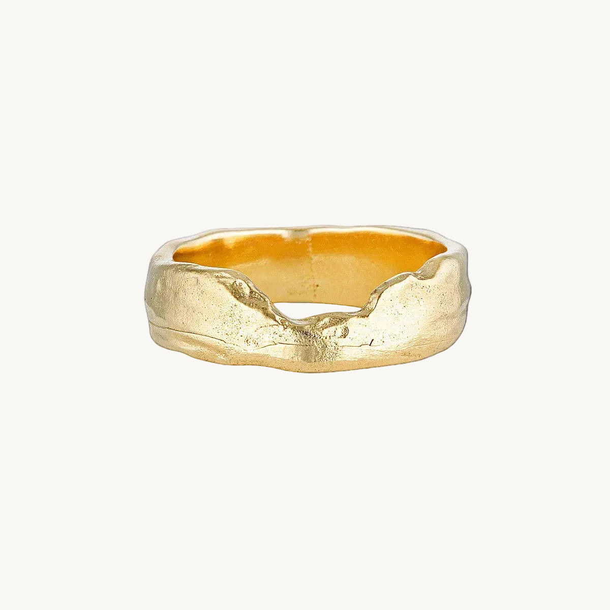 Gold ring with a textured design