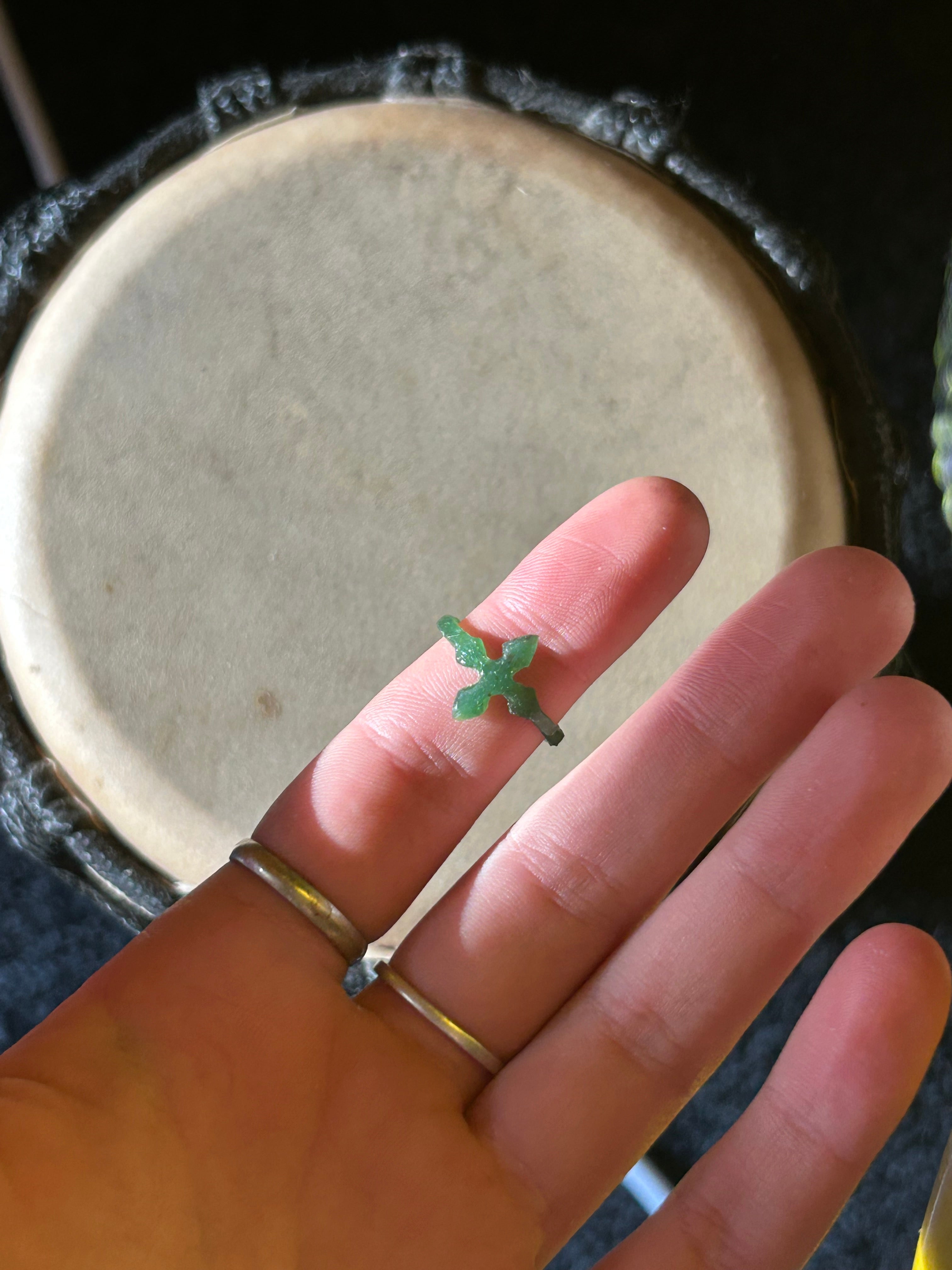 Hand wearing a wax carving of cross ring