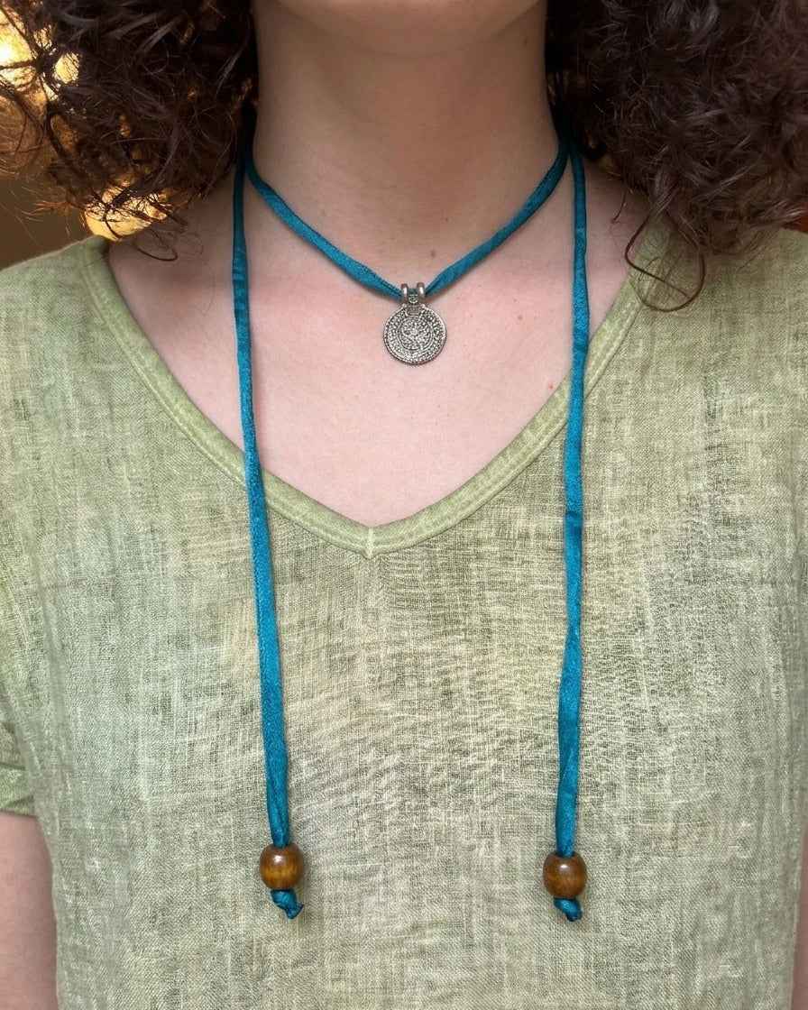 Silk Road Pendant: Elegant Silver Pendant on Silk Cord