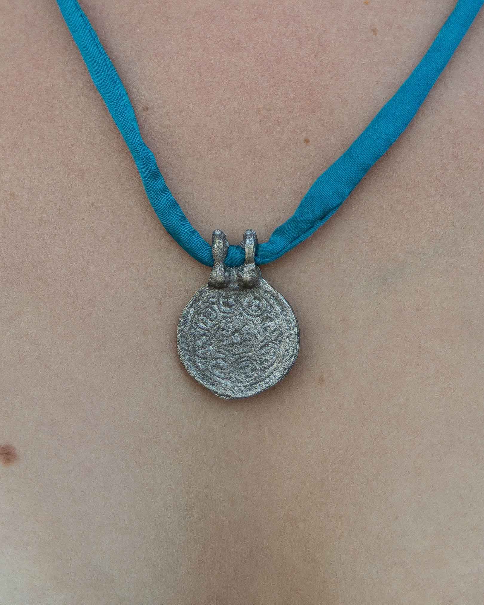 Silk Road Pendant: Elegant Silver Pendant on Silk Cord