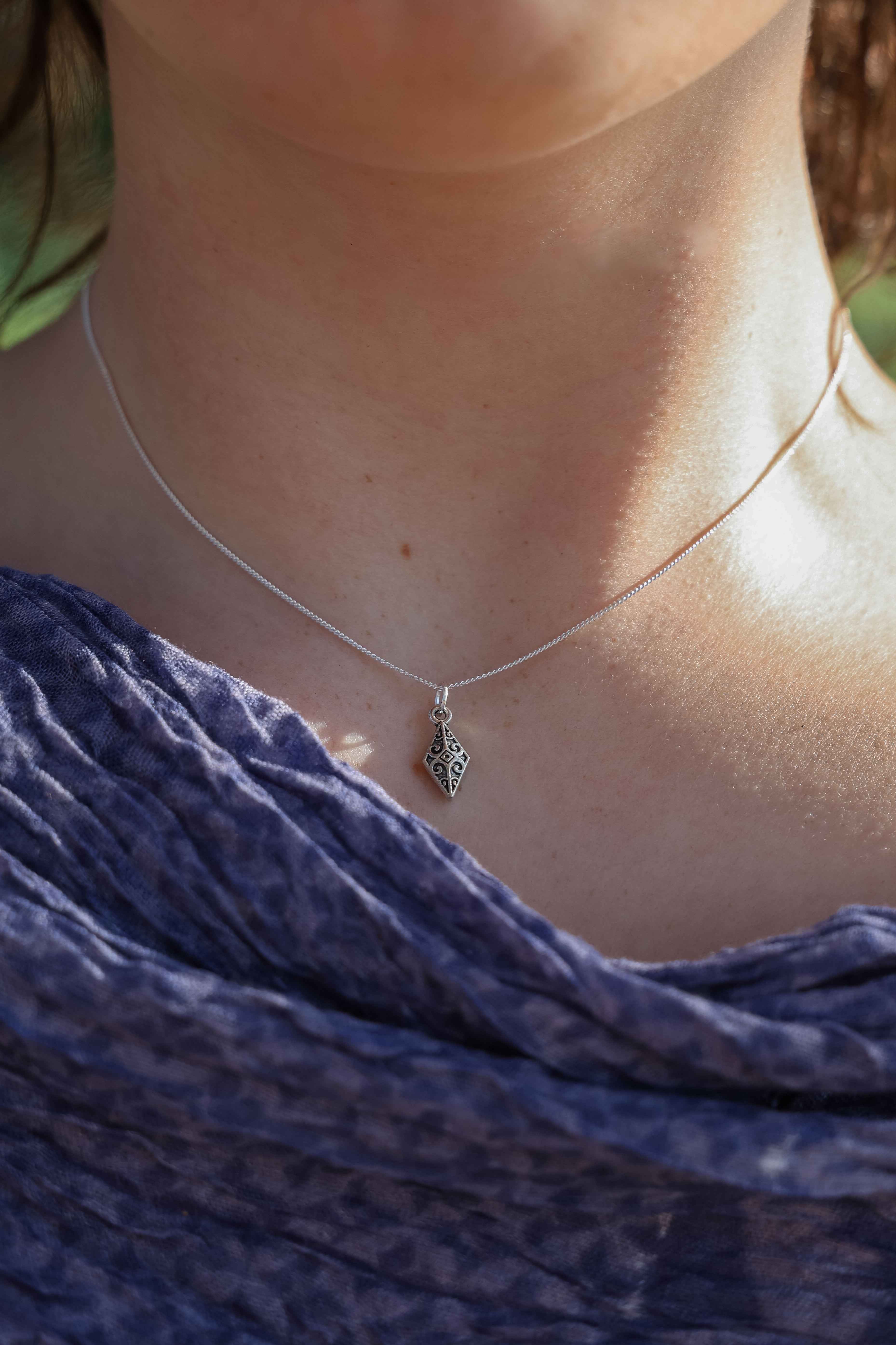 The Arrow Head Silver Pendant: Strength in Simplicity