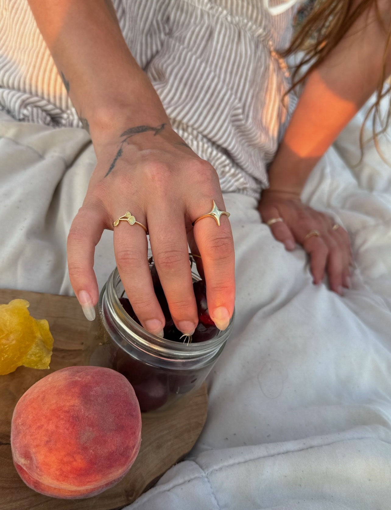 Person showing star ring and ginkgo ring