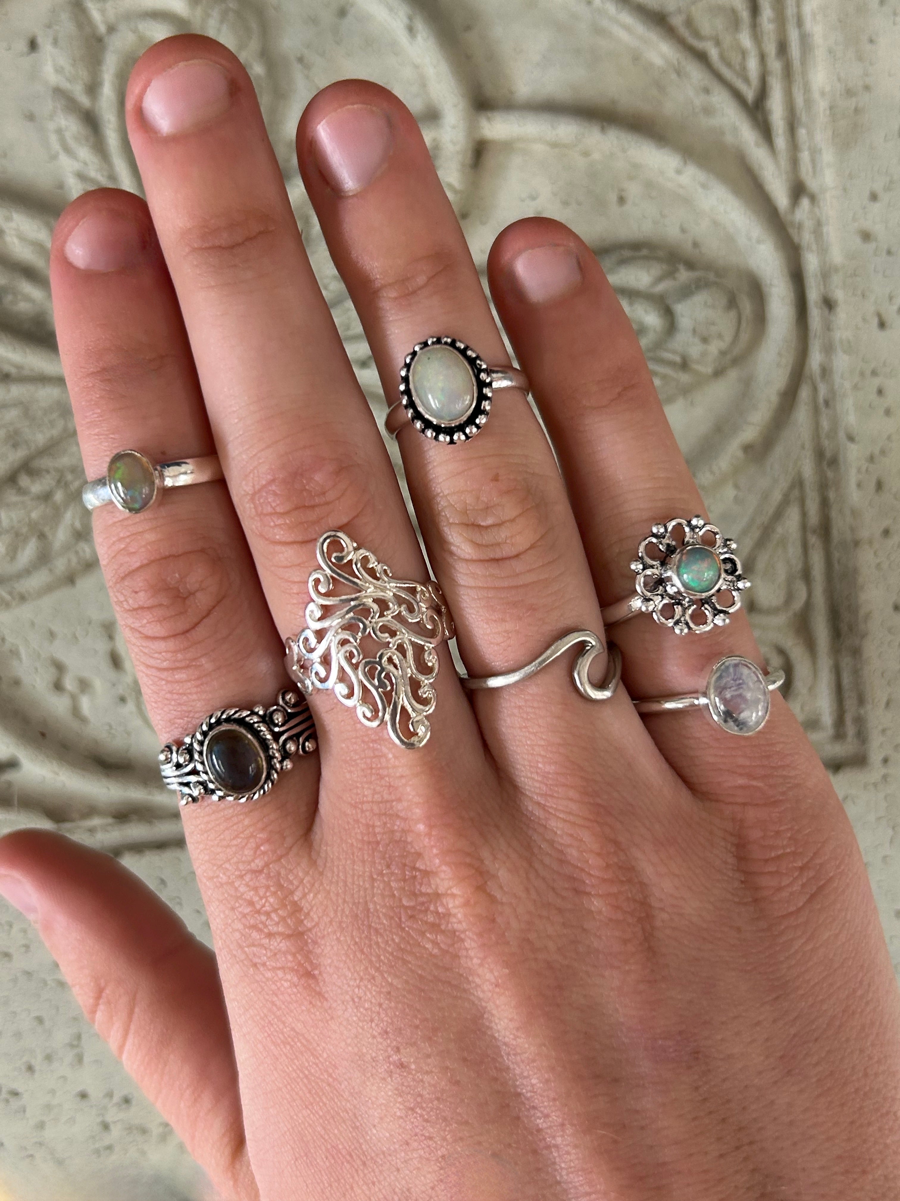Assortment of 925 Sterling Silver Stacking Rings and Adjustable Minimalist Rings displayed together.