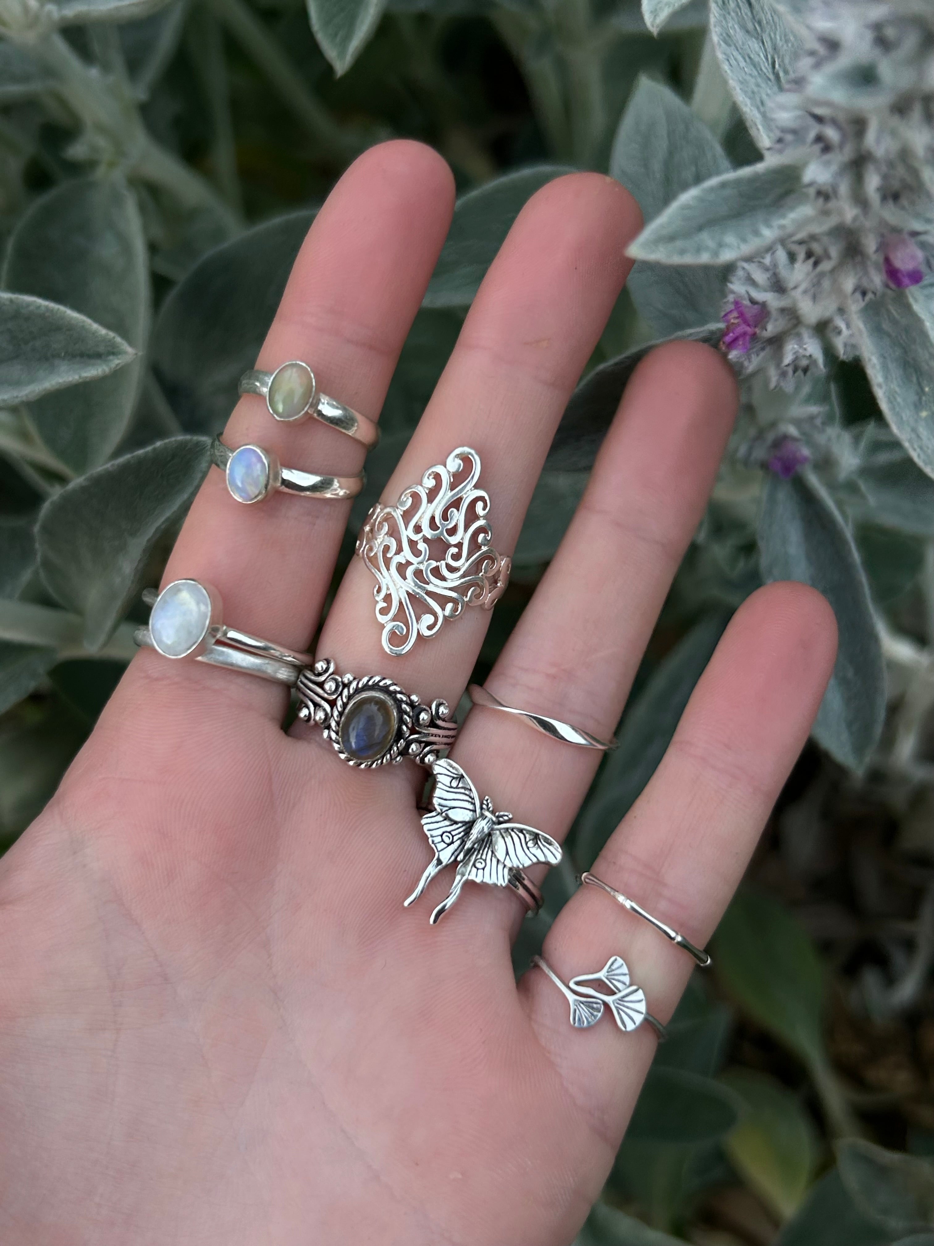 Assortment of 925 Sterling Silver Stacking Rings and Adjustable Minimalist Rings displayed together.