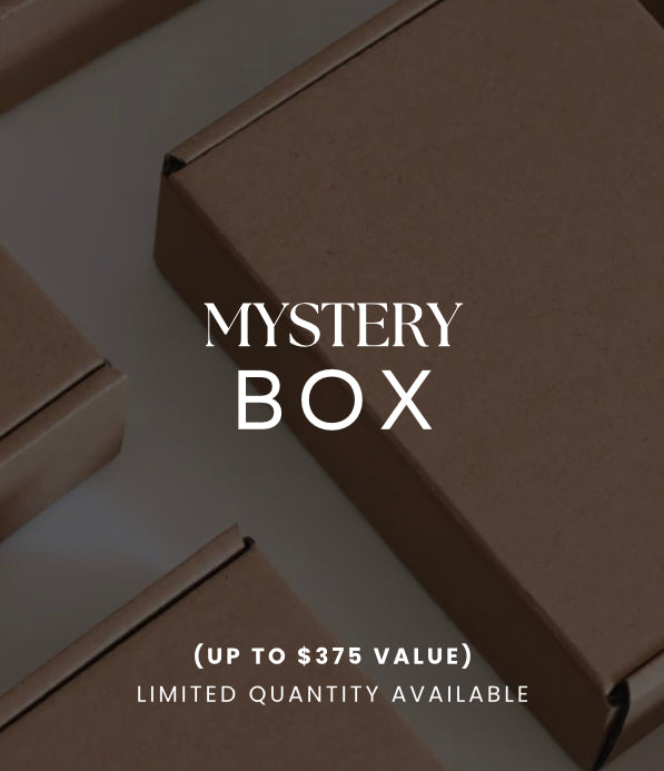 Assorted jewellery items (rings, necklaces, earrings) inside an open jewellery mystery box, highlighting the quality of the customisable ring mystery box contents.