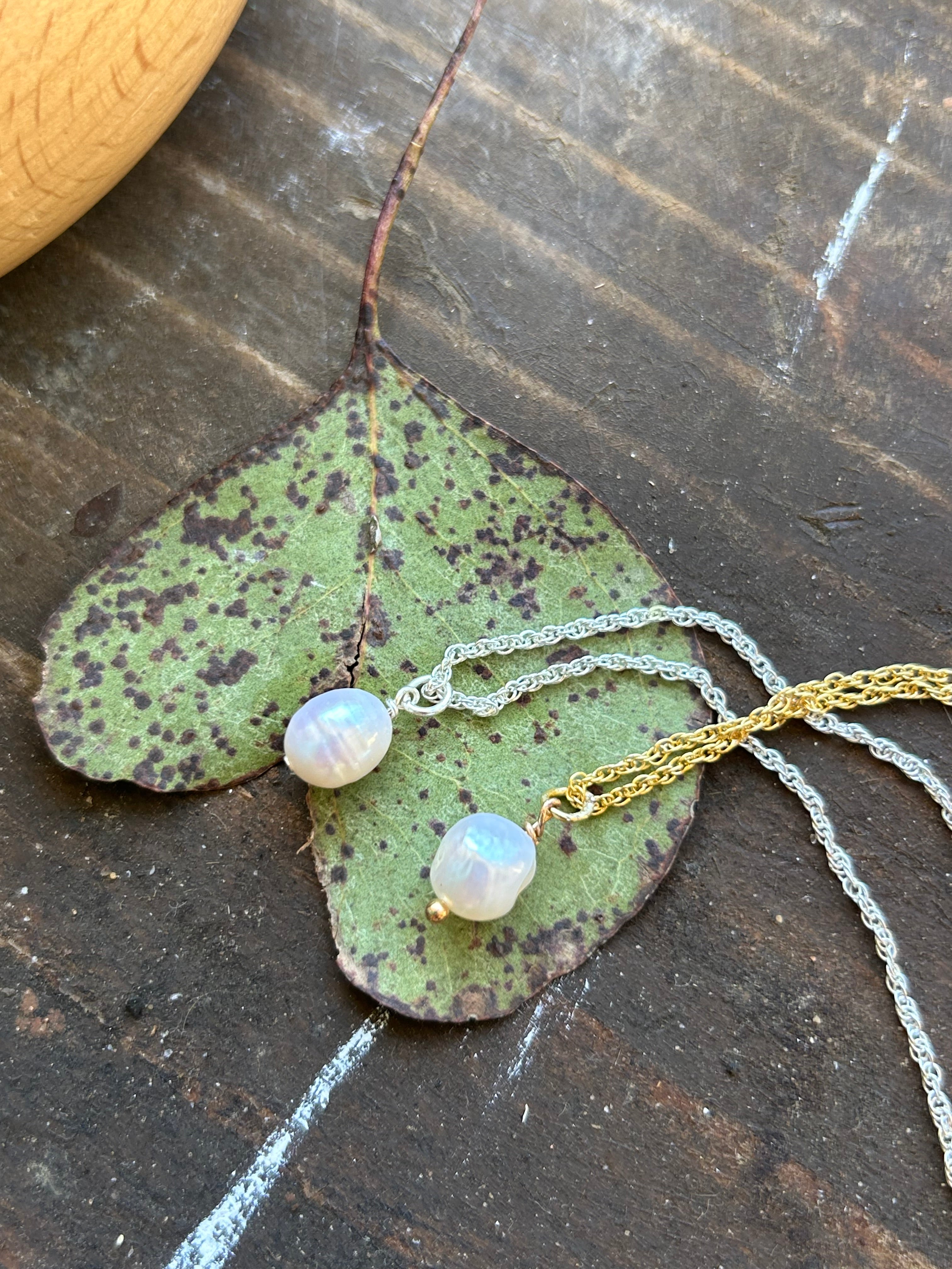 silver and gold pendants flat lay