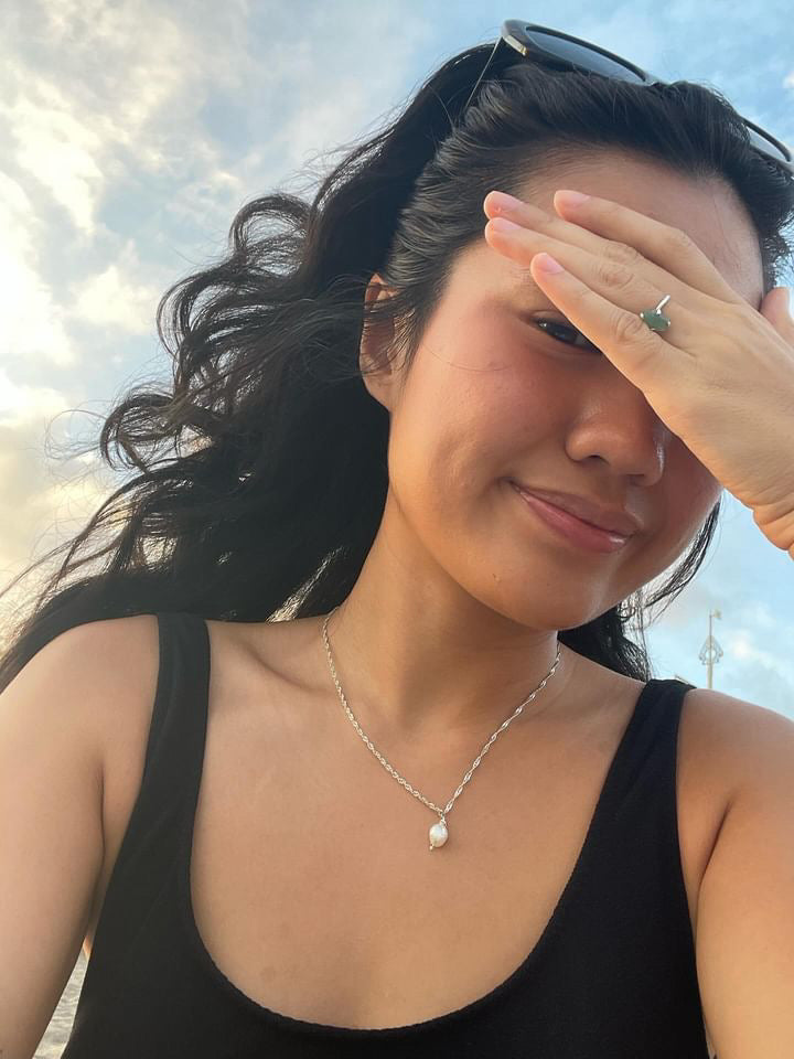 Close-up of a model wearing the Classic silver Pearl Necklace, showing the subtle single pearl drop pendant detail.