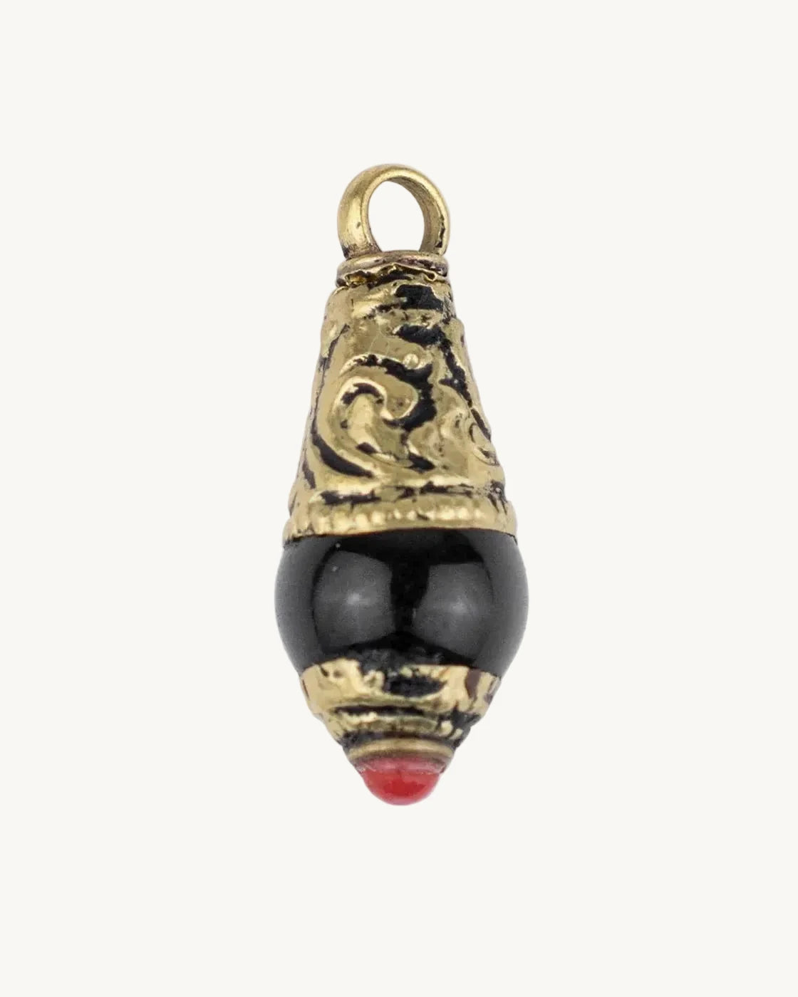 Decorative pendant with gold top and black body on a white background
