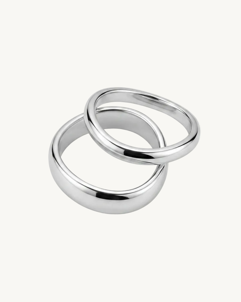 Two silver rings on a white background
