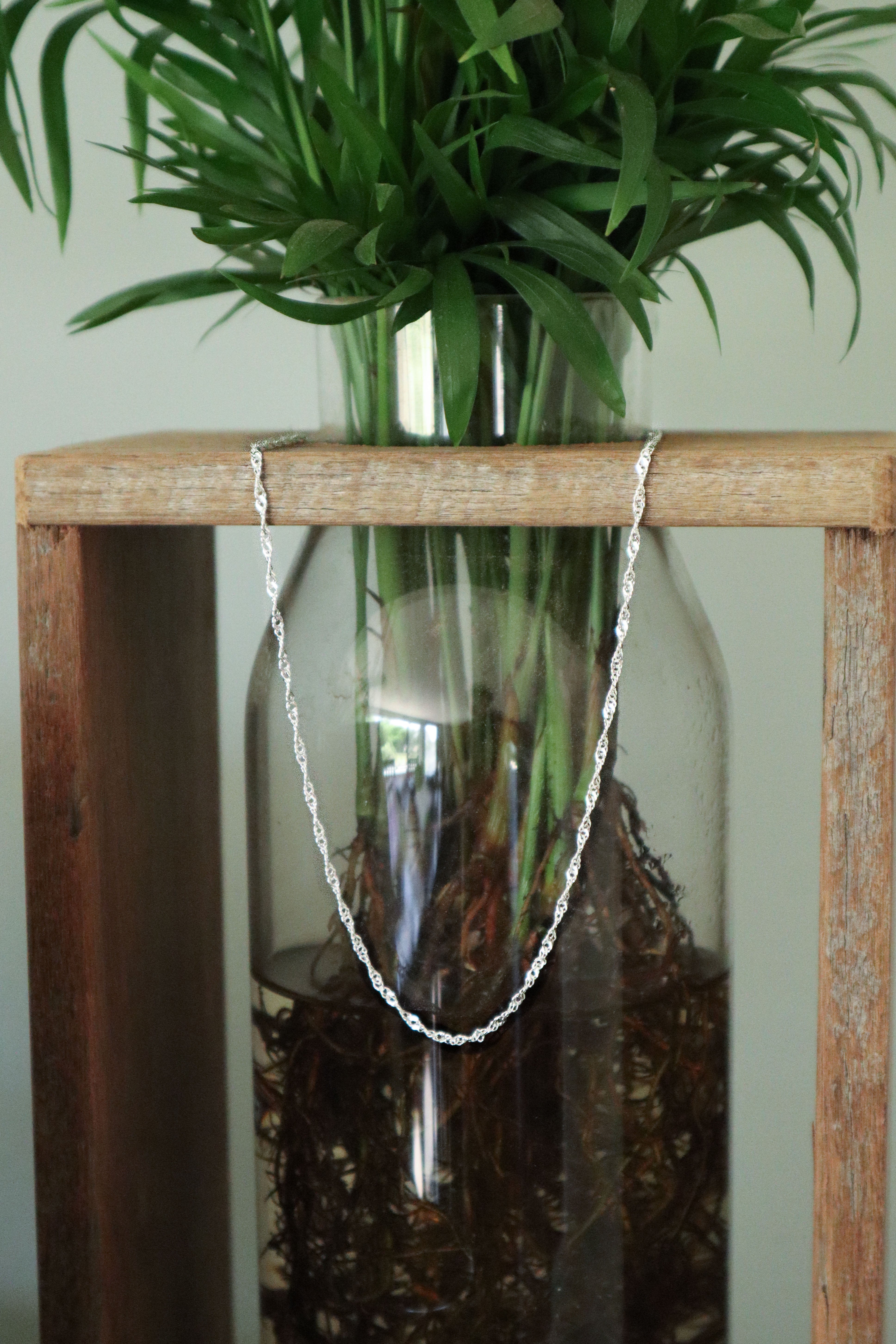 Close-up of the 925 Sterling Silver Singapore Chain, highlighting the intricate multi-link twist detailing.