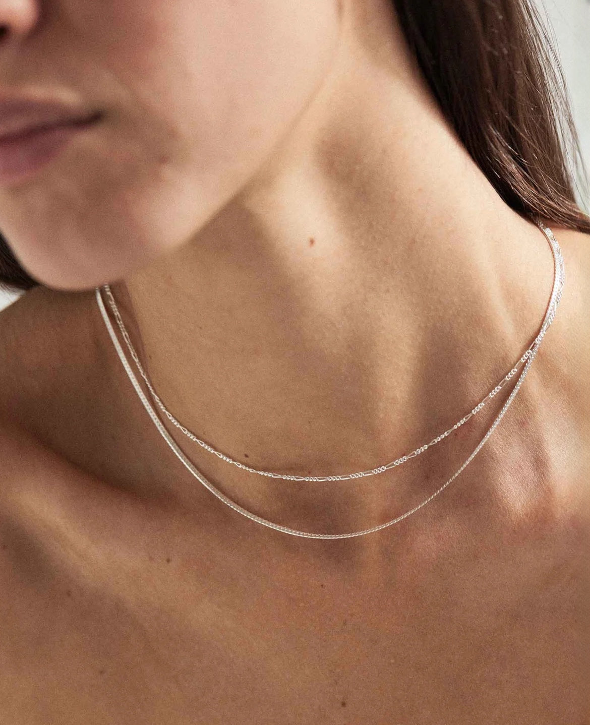 Model wearing the 925 Sterling Silver Singapore Chain and 925 Sterling Silver Snake Chain