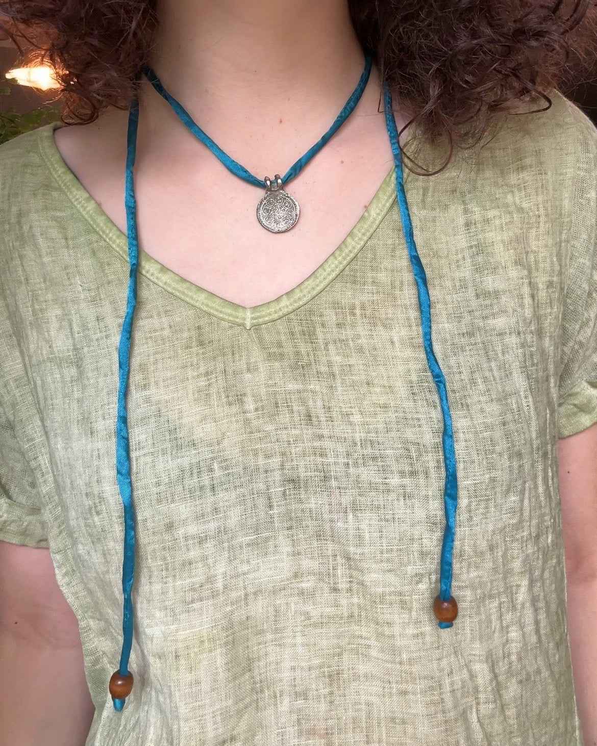 Silk Road Pendant: Elegant Silver Pendant on Silk Cord