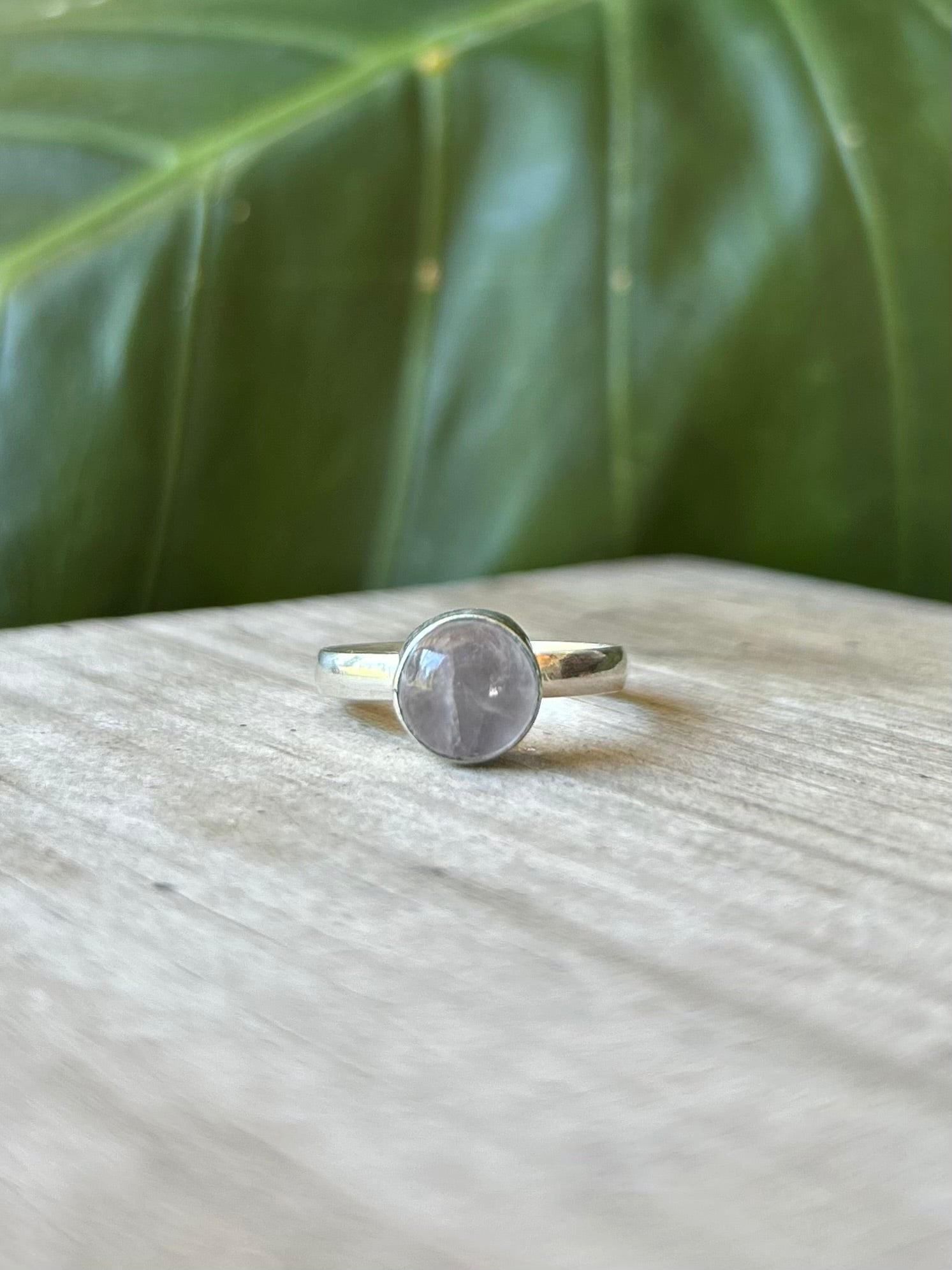Close-up view of the Circular amethyst Gemstone Ring showing the dusty Purple Gemstone Sterling Silver Ring centrepiece and the Recycled 925 Sterling Silver Ring band.