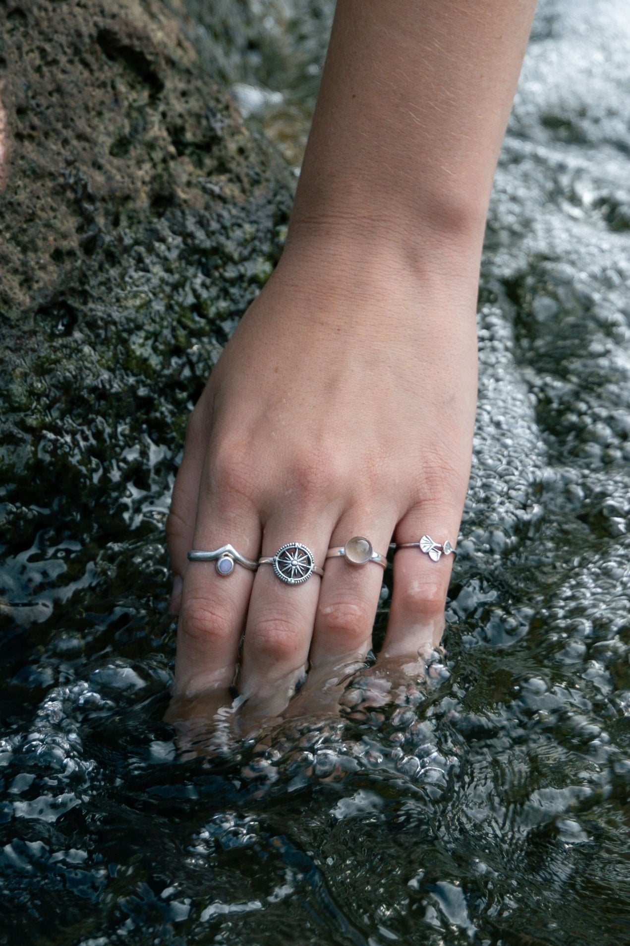 hand modelling ring showing that the rings are waterproof 