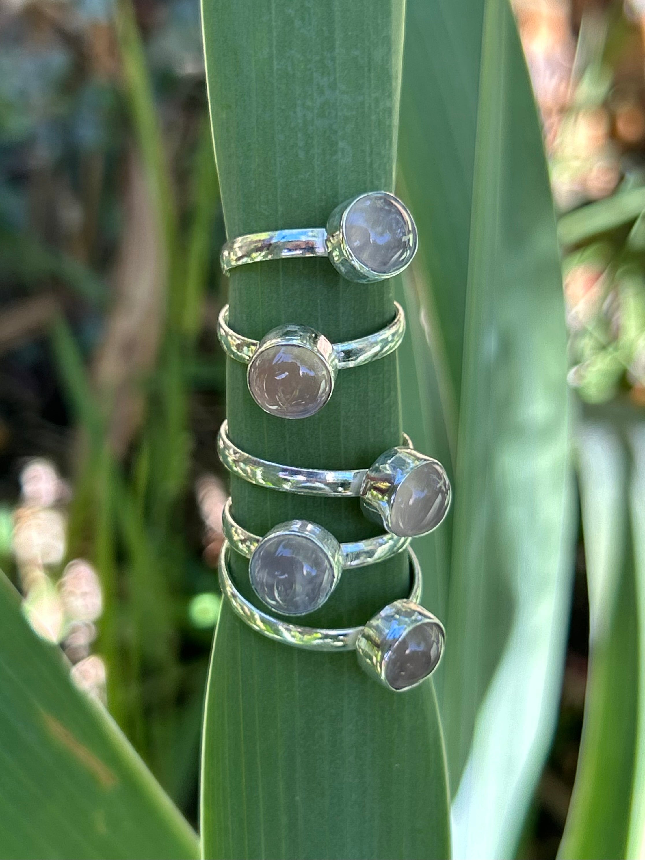 Close-up view of the Circular Gemstone Ring showing the dusty Purple Gemstone Sterling Silver Ring centrepiece and the Recycled 925 Sterling Silver Ring band.