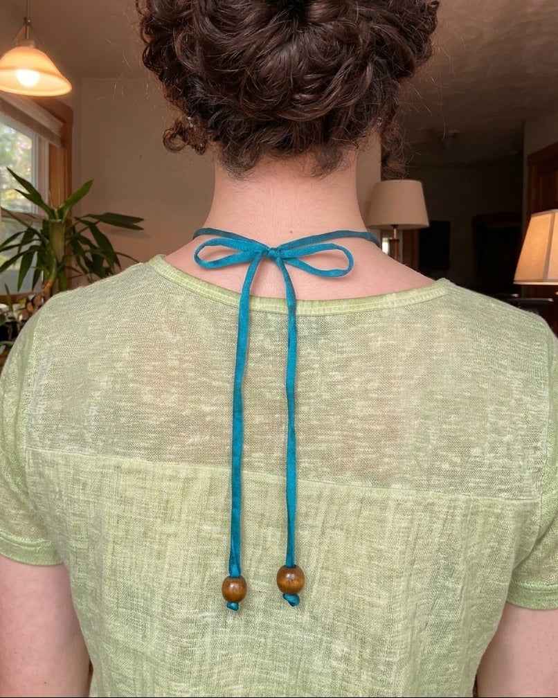 Silk Road Pendant: Elegant Silver Pendant on Silk Cord
