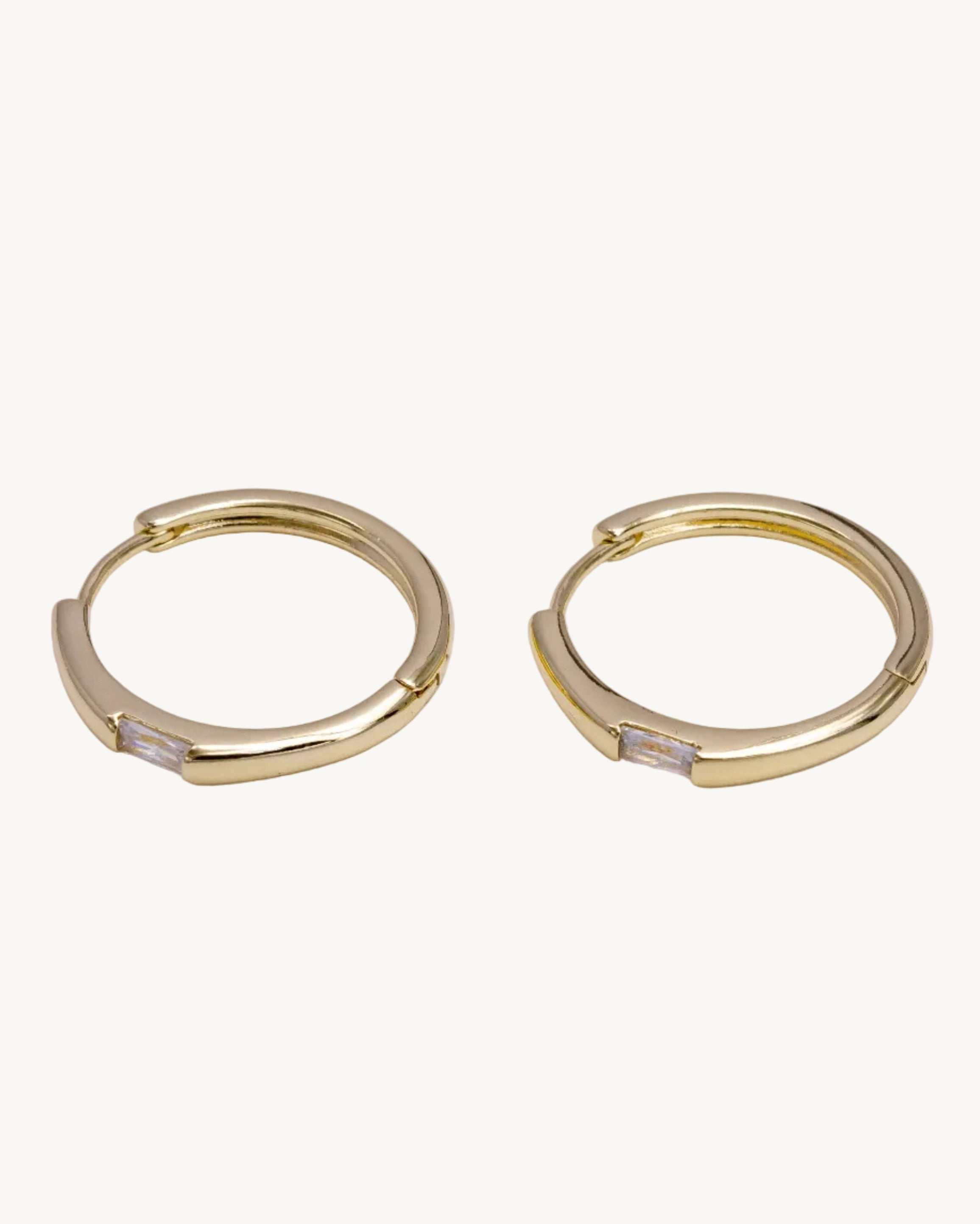 Gold hoop earrings with crystal details 