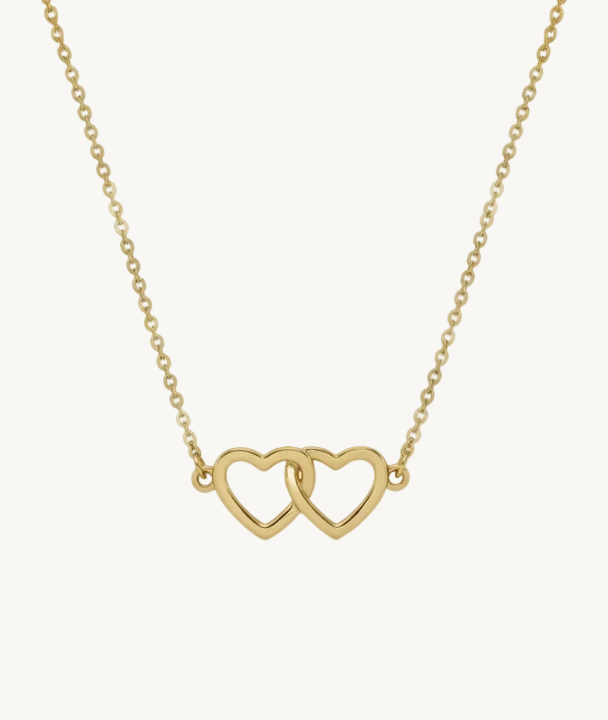Gold necklace with interlocking heart pendants on a gold chain