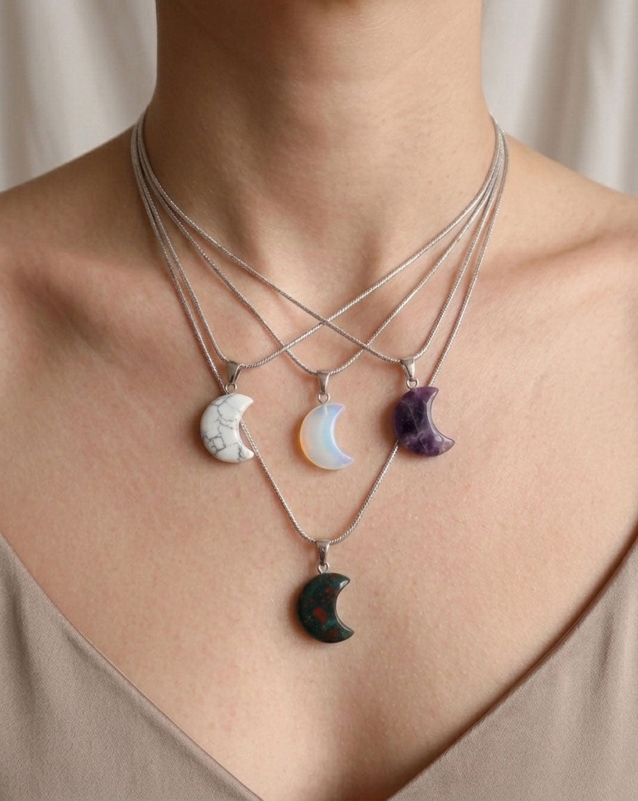 Necklace with moon-shaped pendants on a neutral background