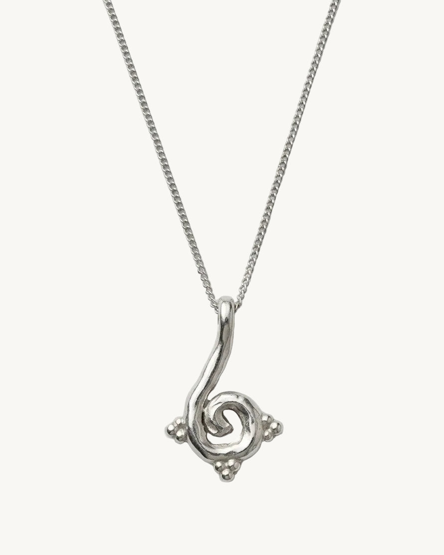Silver necklace with a spiral pendant on a white background